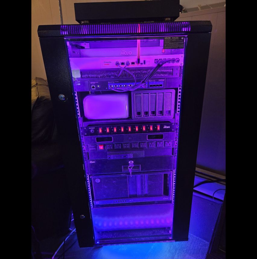 Alexander Mecca’s private systems and AI engineering lab, with networking, compute, and storage equipment in a full rack